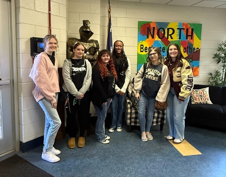 Cadets are standing in the lobby at North.