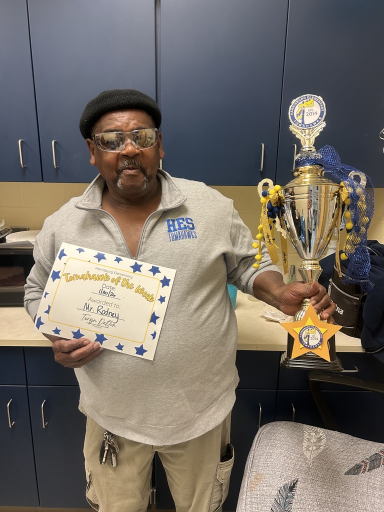 Mr. Rodney with the Tomahawk of the Week trophy