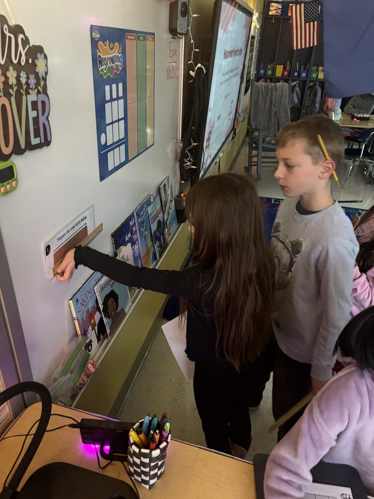 Mrs. Stover's class measuring things in the classroom