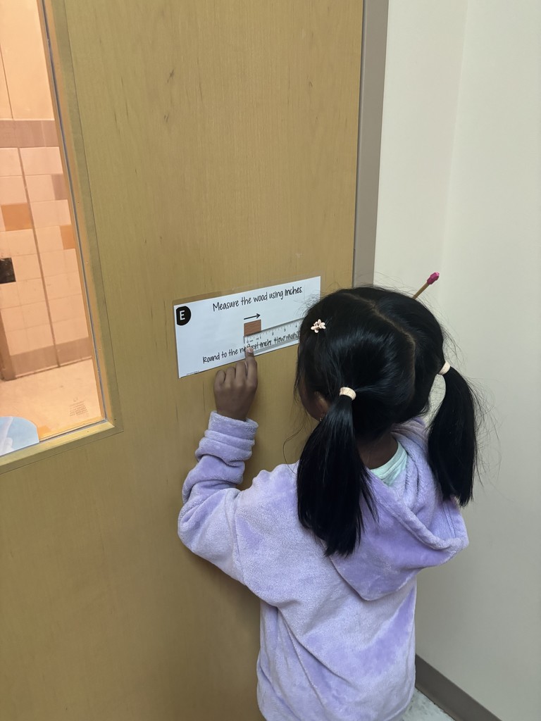 Mrs. Stover's class measuring things in the classroom