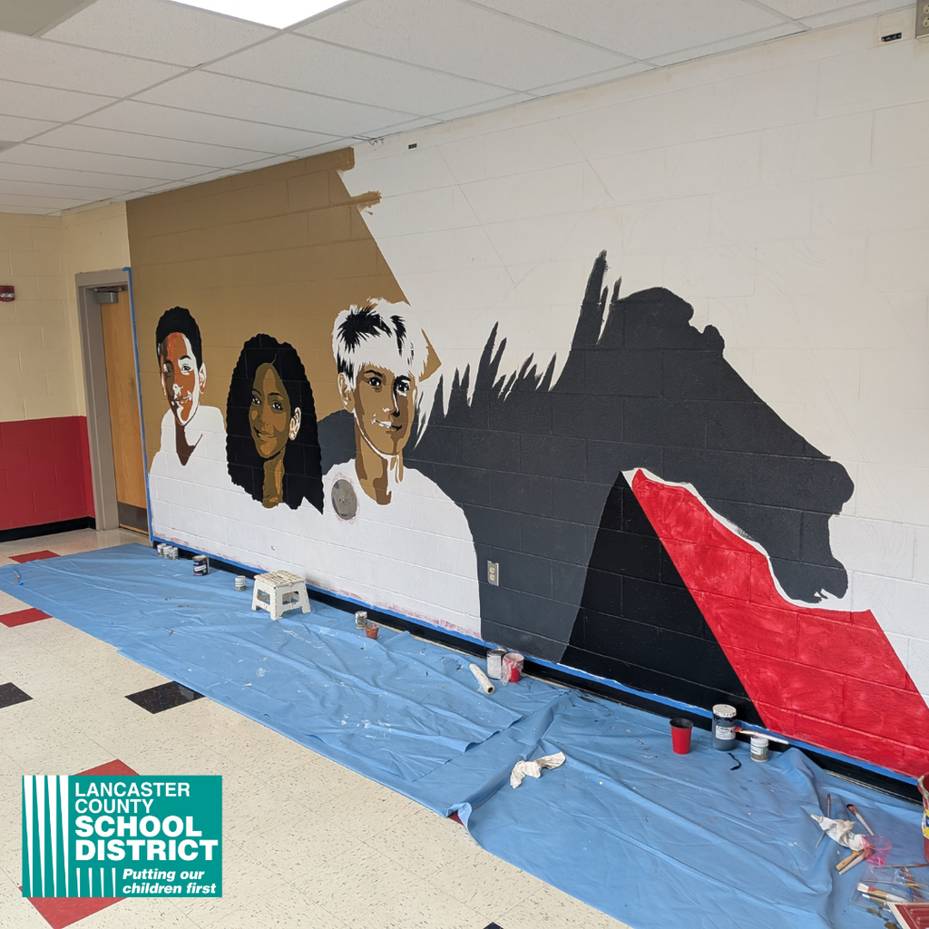South Middle School students painted a hallway mural with the guidance of artist Maria DeFelice.