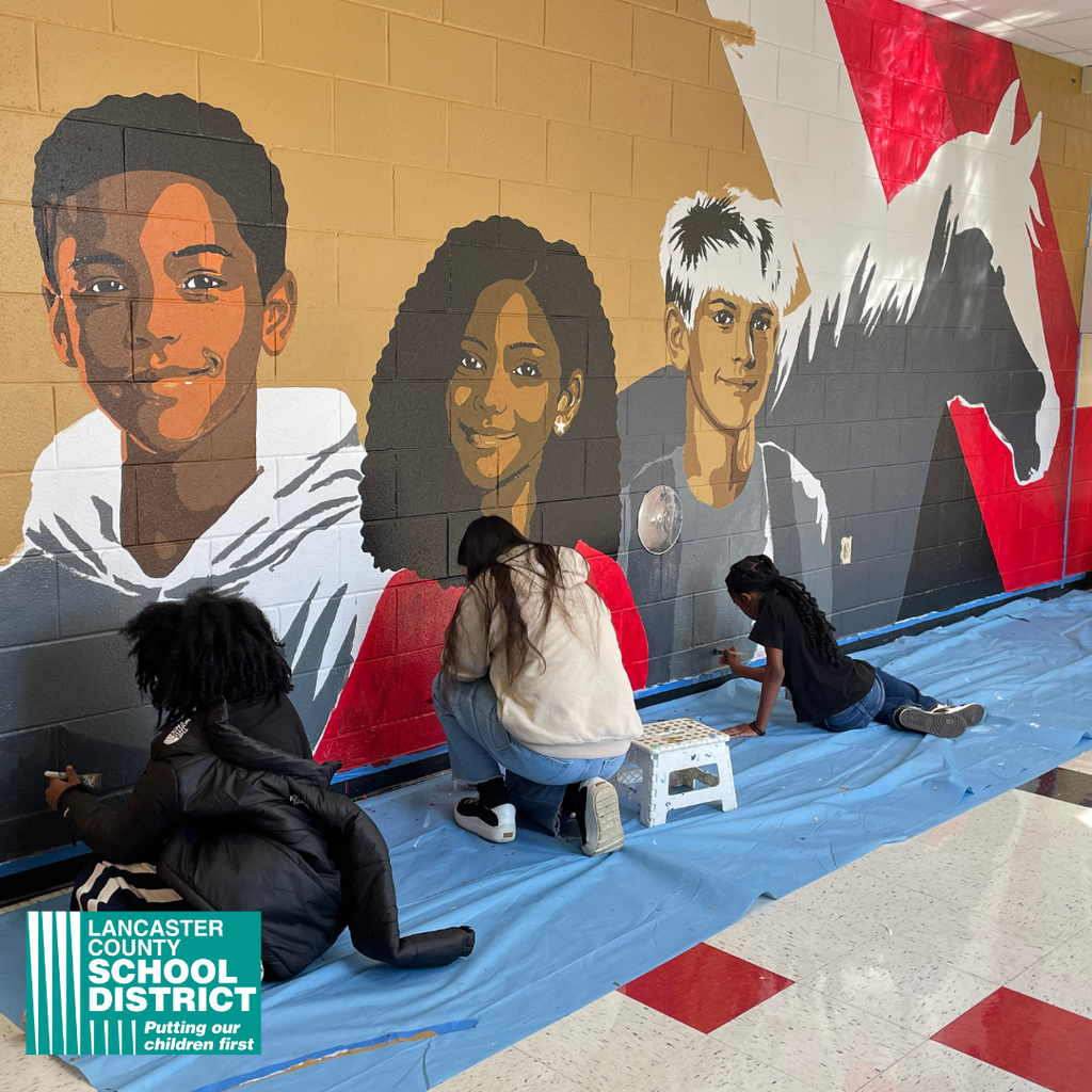South Middle School students painted a hallway mural with the guidance of artist Maria DeFelice.