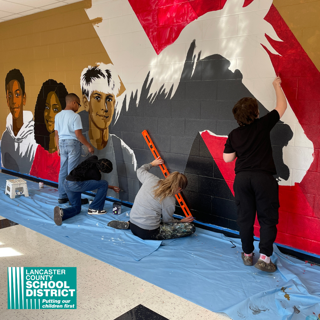 South Middle School students painted a hallway mural with the guidance of artist Maria DeFelice.