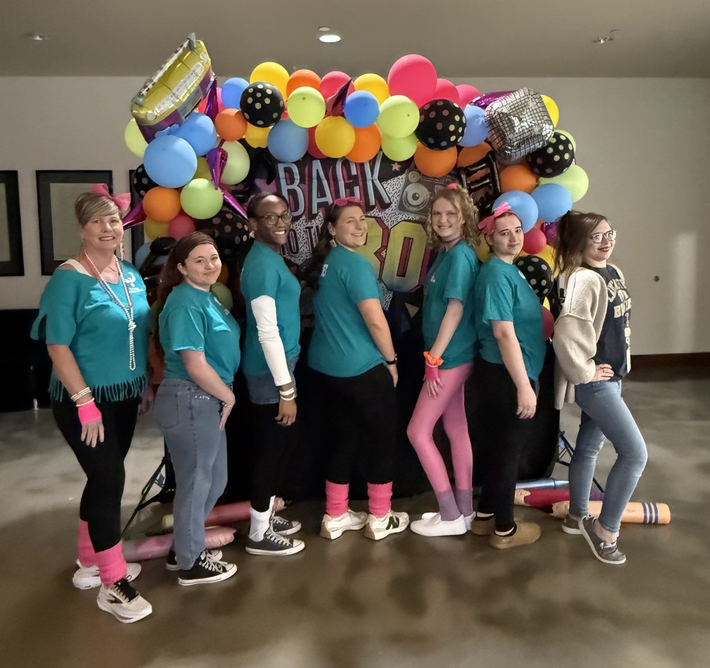 Group pic in front of balloons
