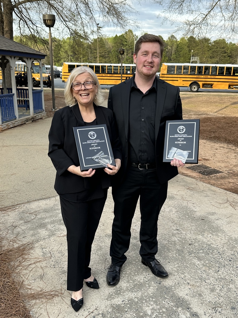 Ms Strauss and Mr Roper pose with their award plaques 