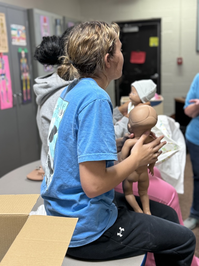 student with newborn