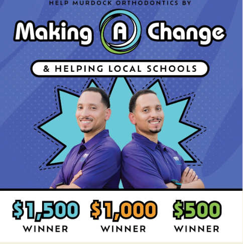 Two men in purple shirts with smiles pose against a blue star background with text about a $1,500 prize.