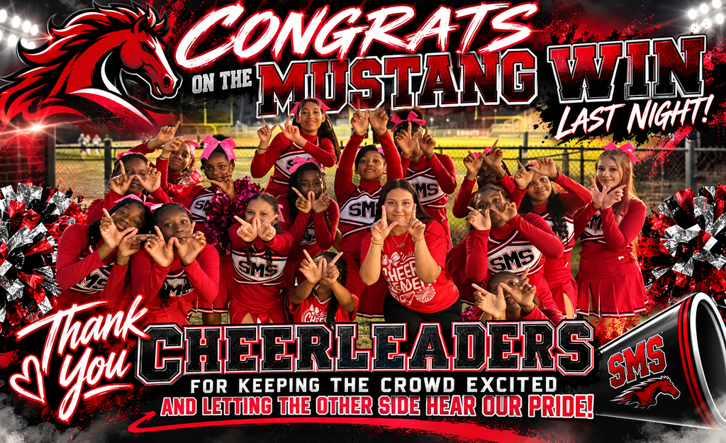 A team of young cheerleaders, wearing red uniforms, stand together with hands raised, celebrating a win.
