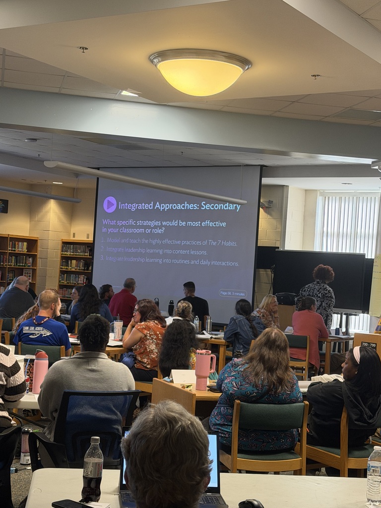 Teachers listening to professional development lesson