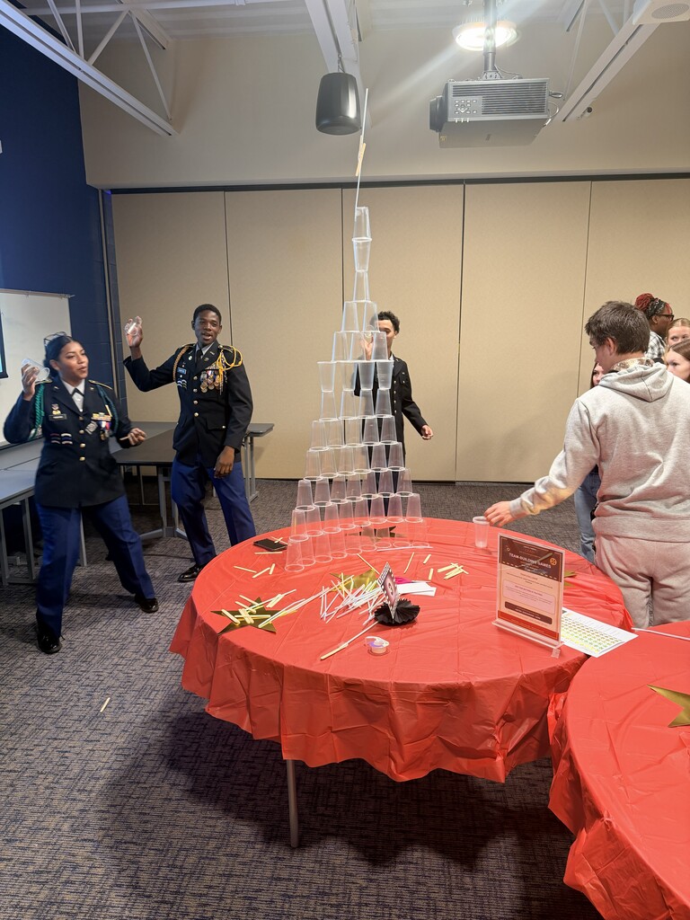 students building tower with cups