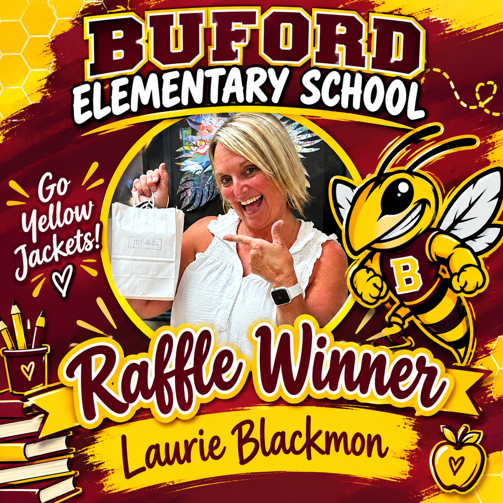 Buford Elementary school attendance clerk posing and holding raffle prize .