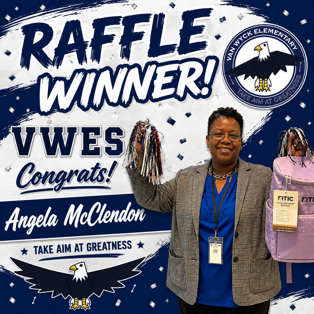 Van Wyck Elementary attendance clerk posing and holding raffle prize.