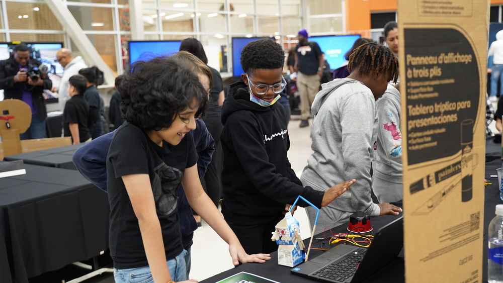 Students working with coding projects