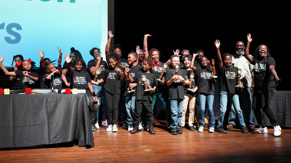 students posing with trophies at Hispanic Heritage Bowl