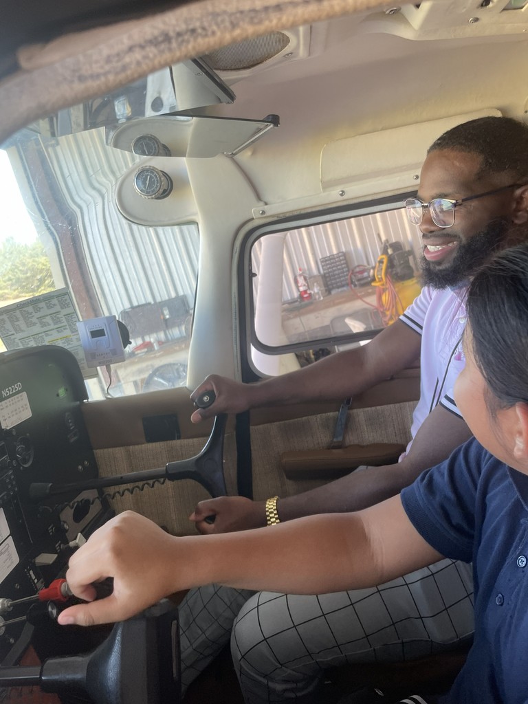 Lanett City Schools 5th and 6th grade students and teachers are at the Lanett Municipal Airport. They are shown looking closely at airplanes and various airport equipment as they learn about aviation.