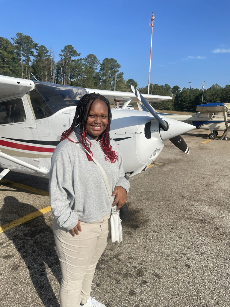 Lanett City Schools 5th and 6th grade students and teachers are at the Lanett Municipal Airport. They are shown looking closely at airplanes and various airport equipment as they learn about aviation.