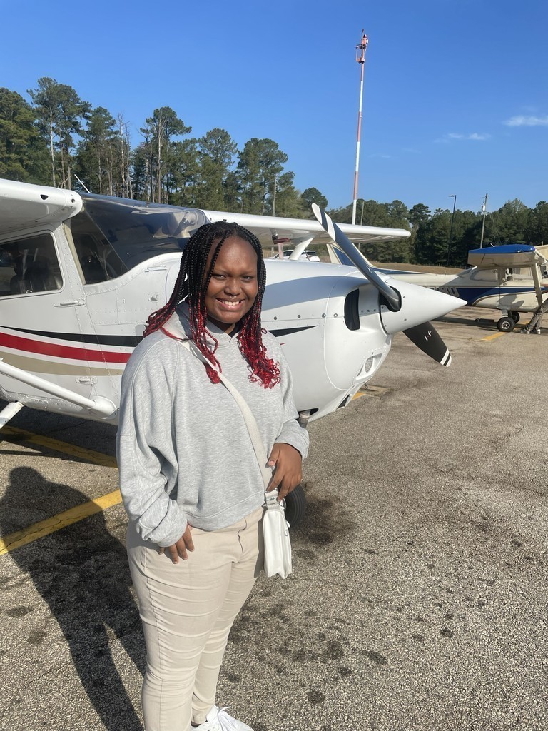 Lanett City Schools 5th and 6th grade students and teachers are at the Lanett Municipal Airport. They are shown looking closely at airplanes and various airport equipment as they learn about aviation.