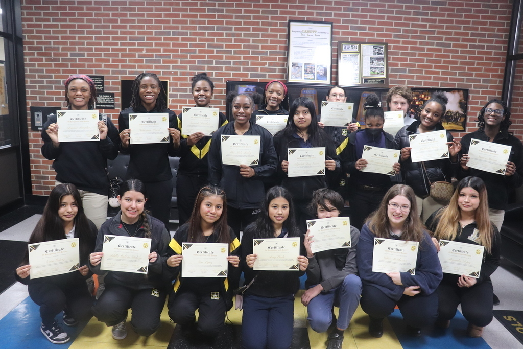 Honor Roll students holding certificates