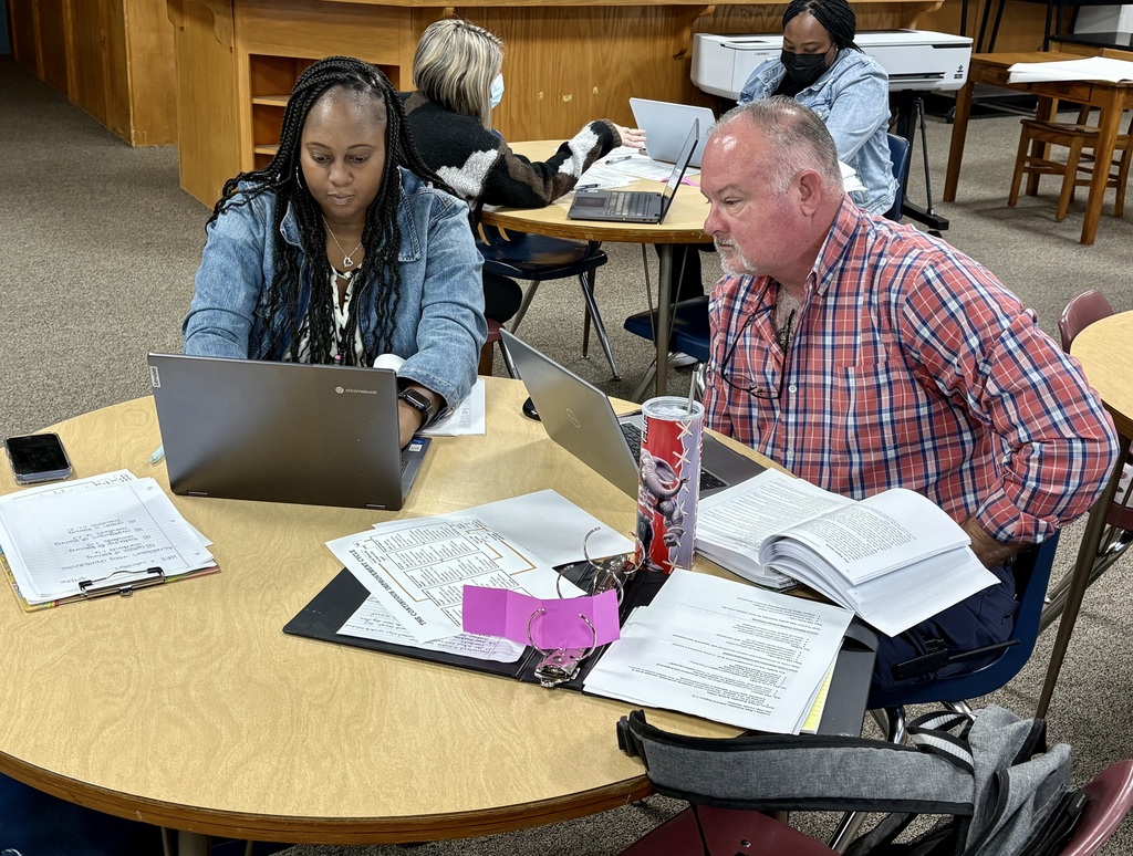 Mrs. McCants & Coach Pankey working together.