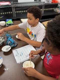 Once upon a STEAM Night so bright, With laughter glowing in every light, The students explored with curious minds, Invention, discovery—so many finds!  They built and tested, mixed and made, Watched ideas grow and never fade. From science sparks to artful dreams, Each table buzzed with joyful teams.  With coding, crafting, puzzles, and play, Excitement carried them all the way. A night of wonder, bold and grand— The magic of learning, hands in hand! ✨