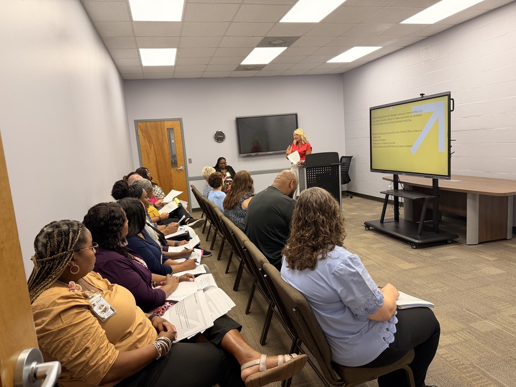 Office Staff reviewing procedures.