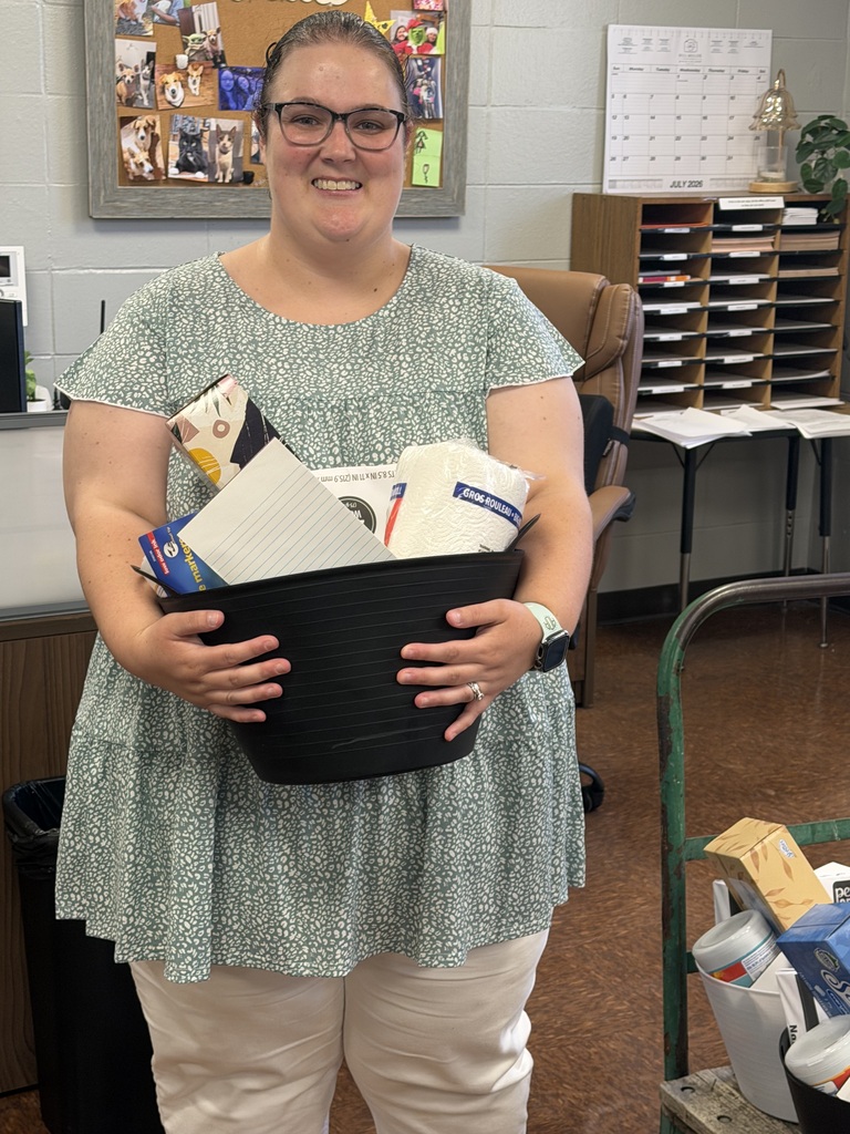 Picture of Mrs. Douglas getting her basket of goodies. 