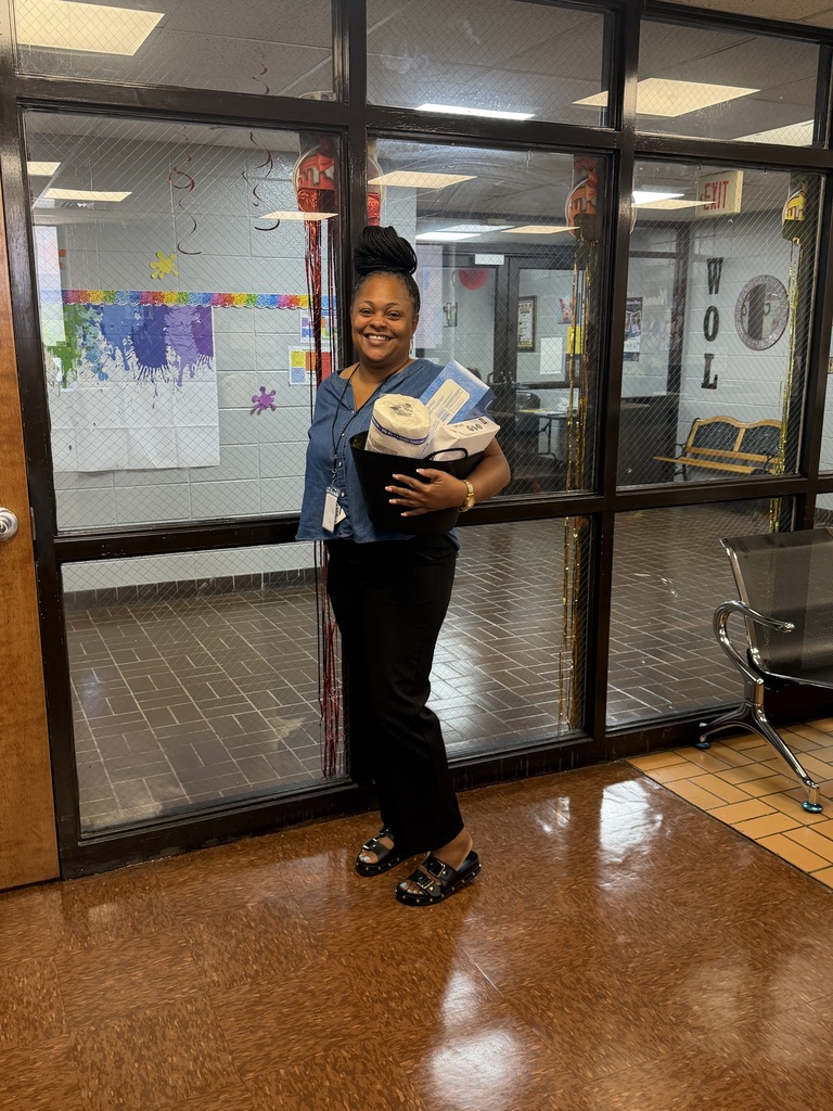 Picture of Mrs. Lee getting her basket of goodies! 