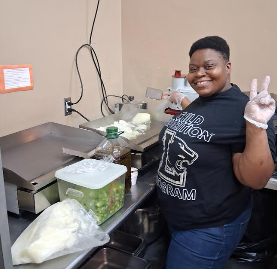 Ms. Williams preparing the food