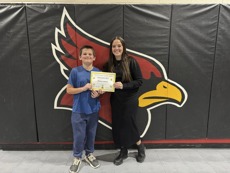 principal handing certificate to student 