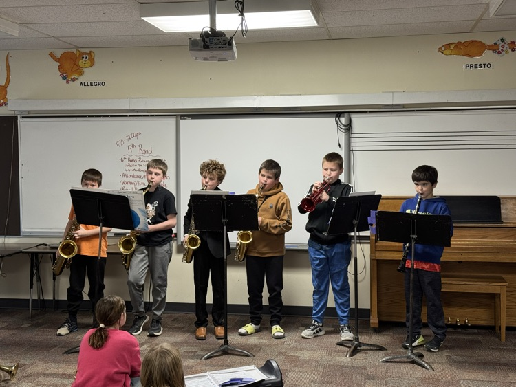 6 students playing saxophone