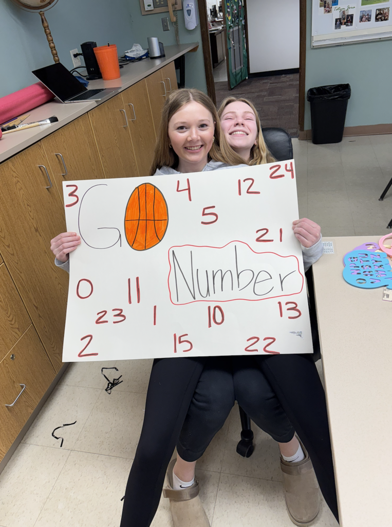 Students holding a sign