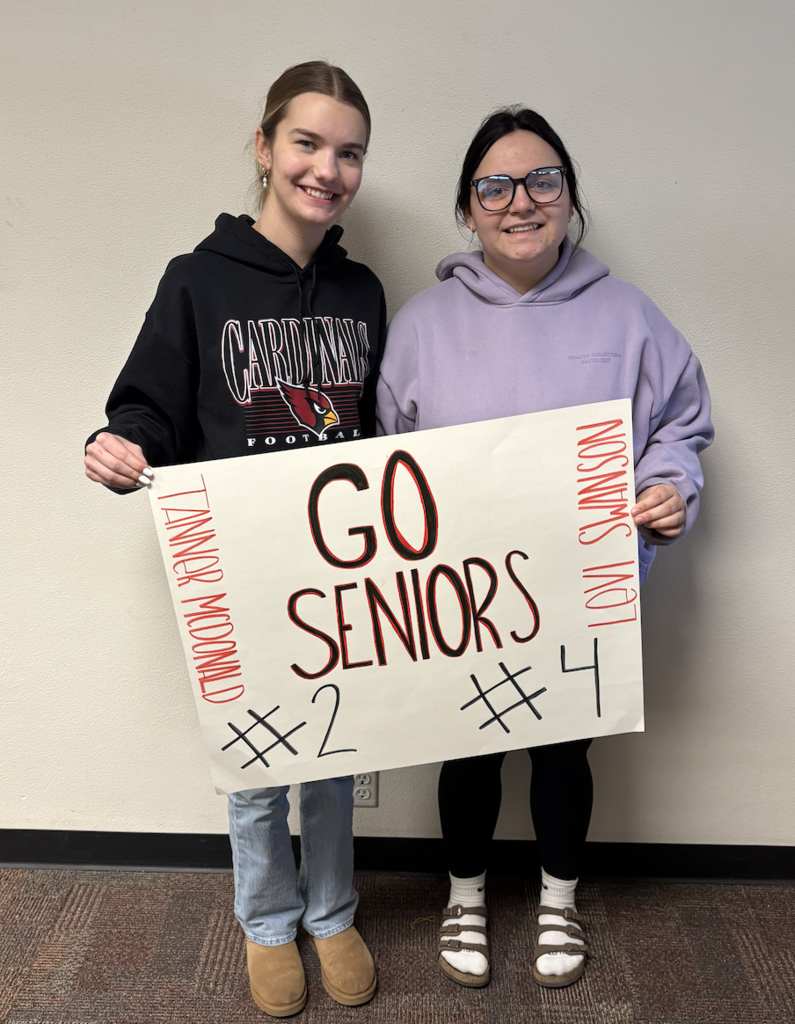 two students with sign