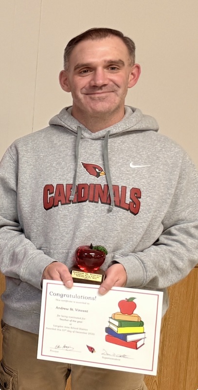 Teacher holding Teacher of the year award award and certificate
