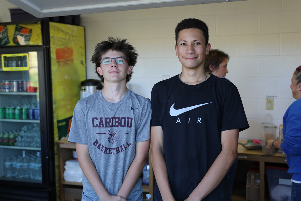 Two students that were serving snacks posing for a picture