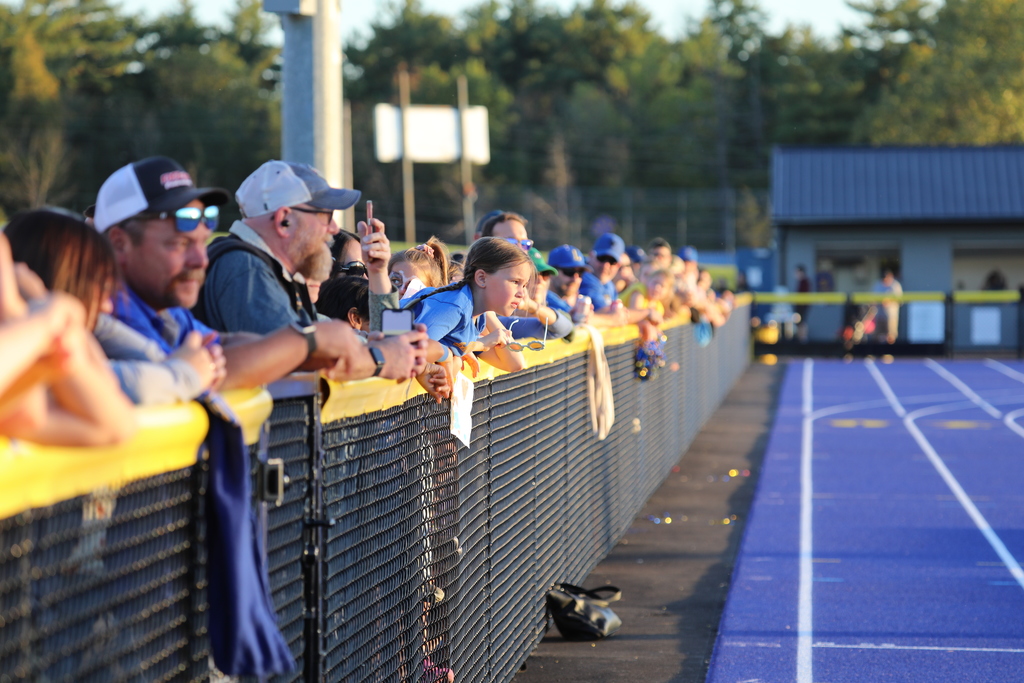 Fans in attendance watching over the fence