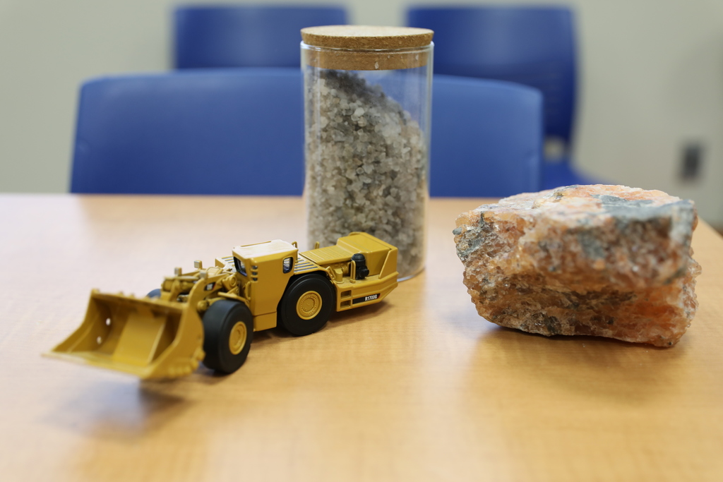 a toy model of the machinery used in the mine, a jew of road salt, and a large piece of salt rock