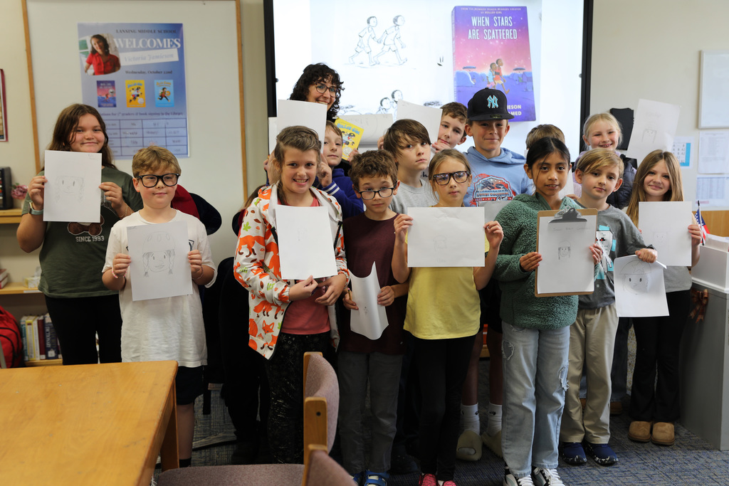 a group photo of the class with the author