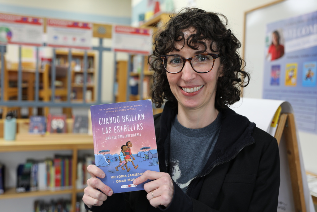 the author holding up her book