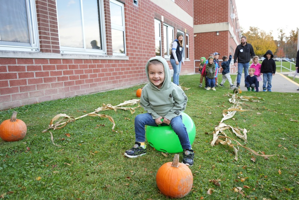 Student at fall fest doing bouncing ball race course