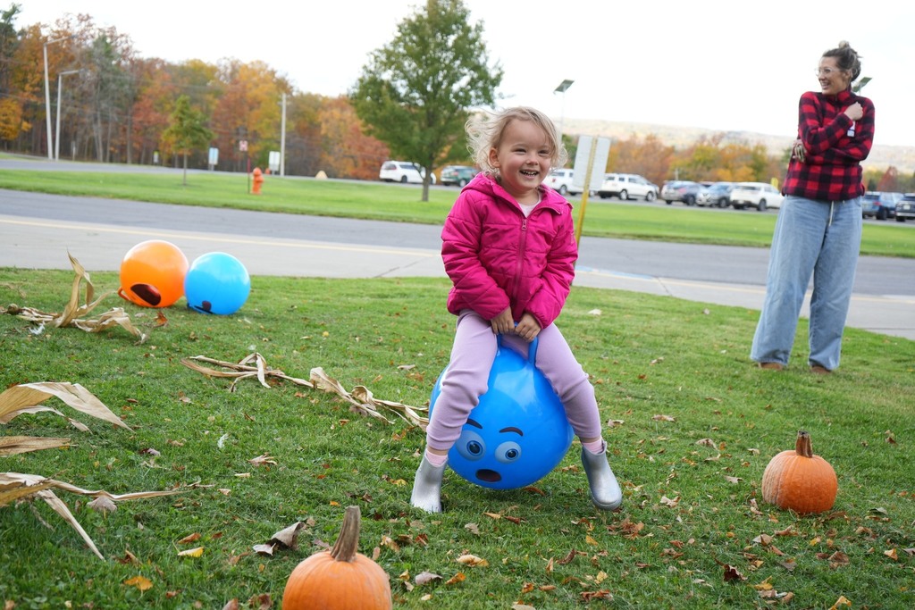 Student at fall fest doing bouncing ball race course