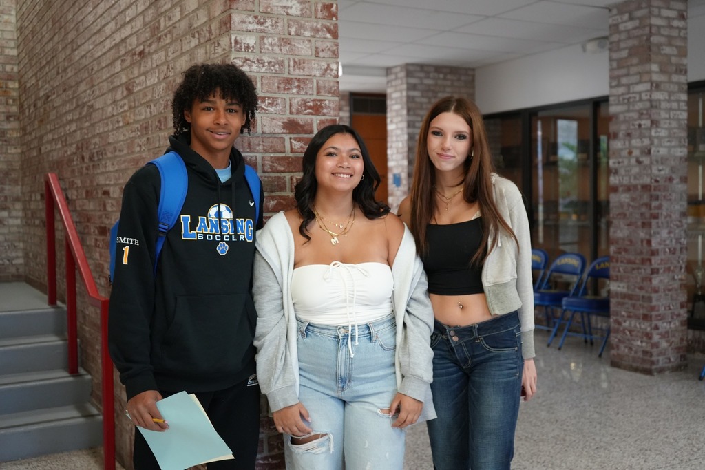 three students from high school smiling