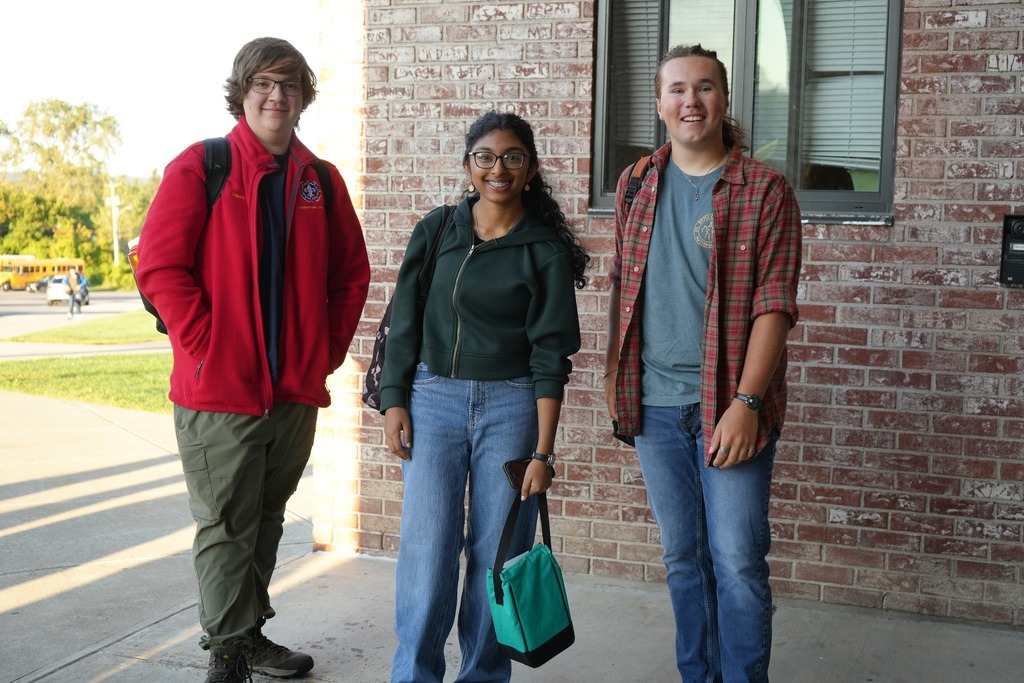 three students from high school smiling