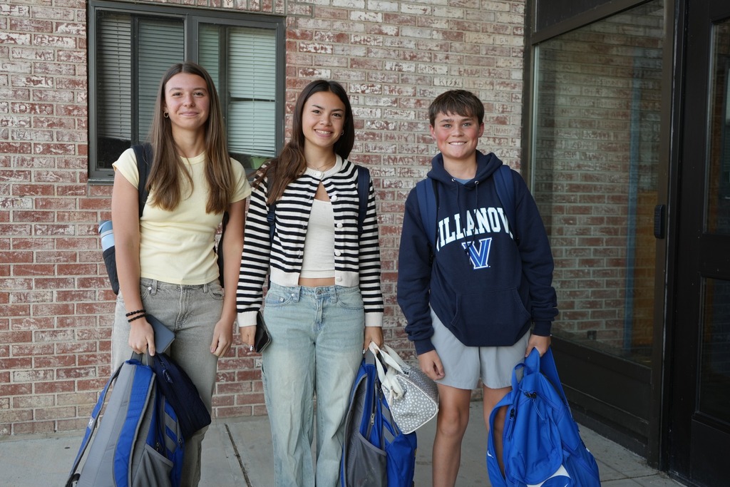 three students from high school smiling