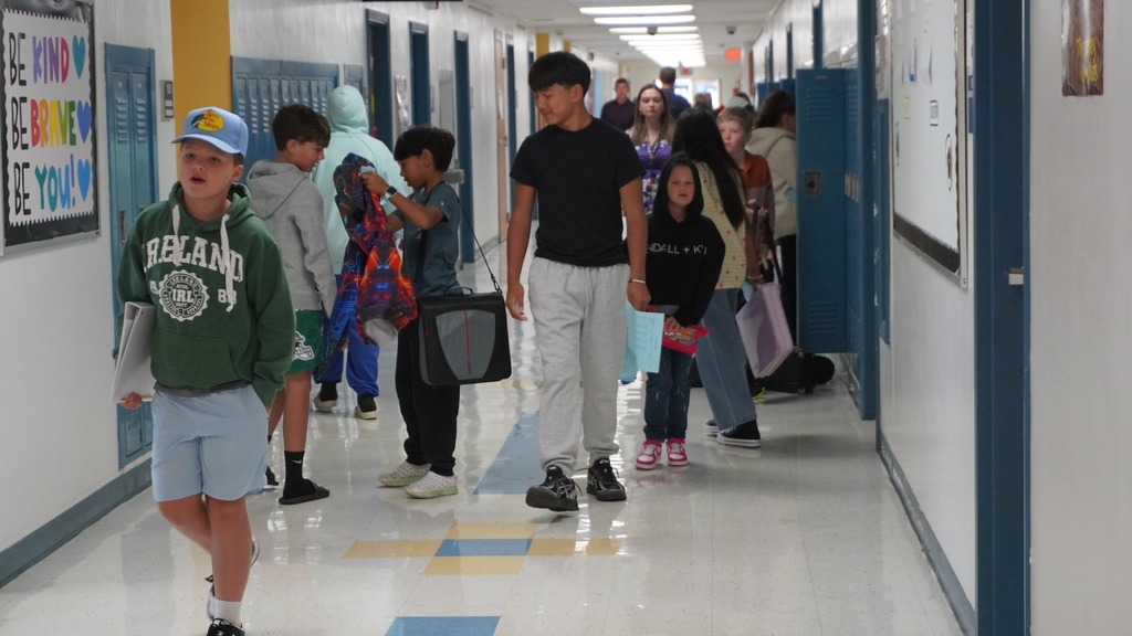 Middle school students walking through LCSD hallway