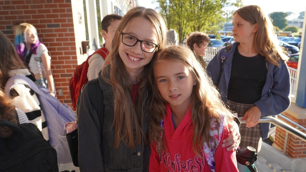 Middle school students gathered and smiling for photo