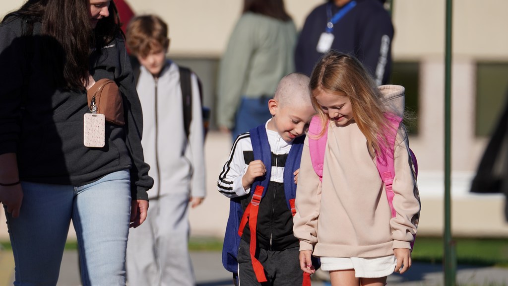 friends smiling together before entering school