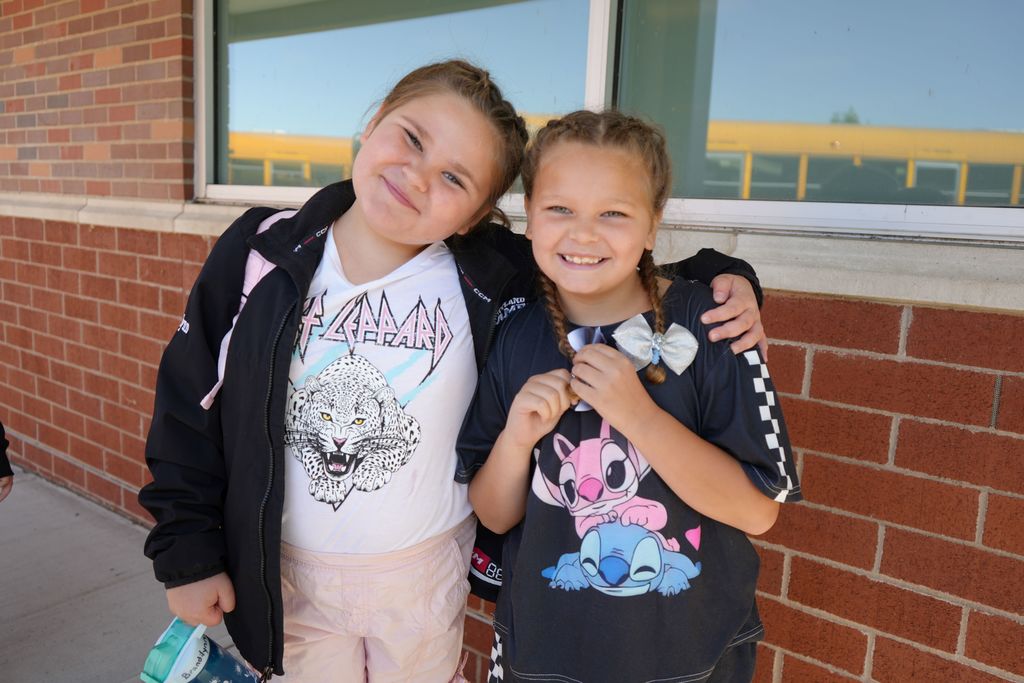 friends smiling together before entering school