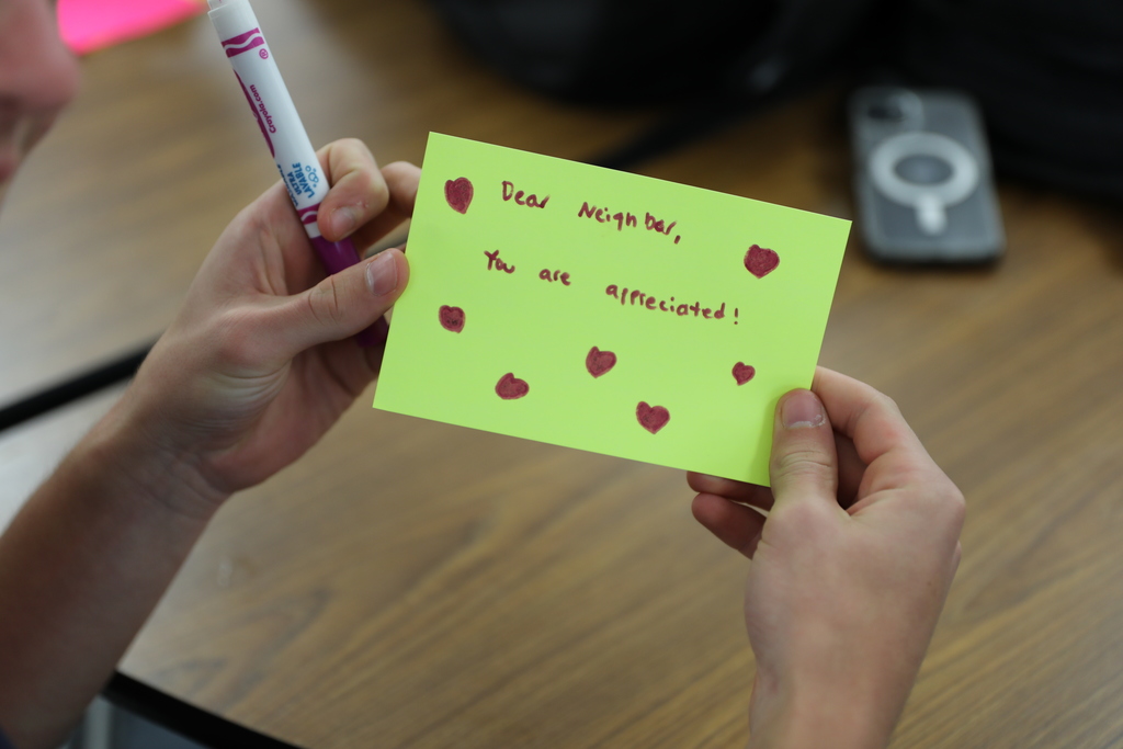 a notecard which reads "dear neighbor, you are appreciated!"