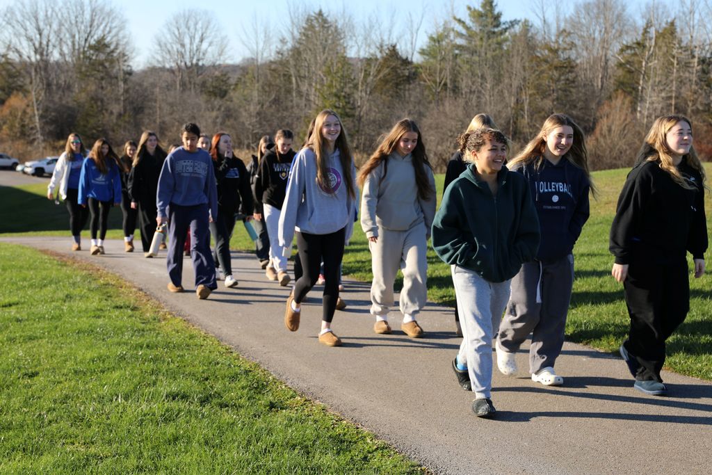 the volleyball team walking up to the Elementary School