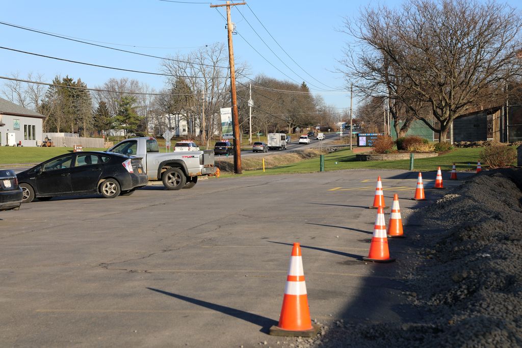 the bus driving away with the police motorcade